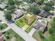 An aerial view of the property showing the well-manicured lawns and mature trees at 1506 Chamberlain Loop, Lake Wales, FL 33853