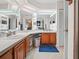 Spacious bathroom featuring dual sinks and bright, overhead lighting at 1506 Chamberlain Loop, Lake Wales, FL 33853