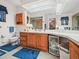 Well-lit bathroom featuring light-colored cabinets and a large mirror at 1506 Chamberlain Loop, Lake Wales, FL 33853