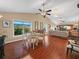 Dining area featuring hardwood floors with a glass table and chairs at 1506 Chamberlain Loop, Lake Wales, FL 33853