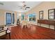 Bright dining room features wood floors, a ceiling fan, and natural light from the windows at 1506 Chamberlain Loop, Lake Wales, FL 33853