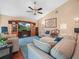 Spacious living room with a fireplace and comfortable seating at 1506 Chamberlain Loop, Lake Wales, FL 33853