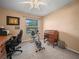 Office with desk, office chair, exercise bike, and storage, filled with natural light from the window at 1506 Chamberlain Loop, Lake Wales, FL 33853