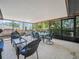 Screened-in patio with plenty of seating and lush tropical views is perfect for outdoor entertaining at 1506 Chamberlain Loop, Lake Wales, FL 33853
