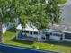 Aerial view of homes with well-maintained landscaping, mature trees, and community features at 1531 Oakview Se Cir, Winter Haven, FL 33880