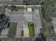 Overhead shot captures well kept lawn and roofs of the building complex and manicured landscaping at 1531 Oakview Se Cir, Winter Haven, FL 33880