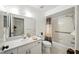 Well-lit bathroom with a shower-tub combo, ample counter space, and modern fixtures at 1531 Oakview Se Cir, Winter Haven, FL 33880