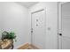 Bright foyer with neutral walls and a white door with a window at 1531 Oakview Se Cir, Winter Haven, FL 33880