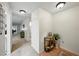 Hallway with hardwood floors, neutral carpet, and tasteful decor at 1531 Oakview Se Cir, Winter Haven, FL 33880