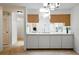 Bright kitchen featuring a white countertop, wood cabinets, and modern appliances at 1531 Oakview Se Cir, Winter Haven, FL 33880