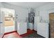 Laundry area with appliances and entrance to kitchen at 1531 Oakview Se Cir, Winter Haven, FL 33880