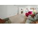 Spacious living room with plush seating, carpet, and a view of the kitchen at 1531 Oakview Se Cir, Winter Haven, FL 33880