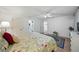 Comfortable bedroom with neutral walls, hardwood floors, ceiling fan and direct access to the bathroom at 1531 Oakview Se Cir, Winter Haven, FL 33880