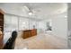 Bright office with wooden desk, cabinets, ceiling fan, and lots of natural light at 1531 Oakview Se Cir, Winter Haven, FL 33880