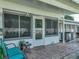 Inviting covered patio with bench seating and entrance to the home at 1531 Oakview Se Cir, Winter Haven, FL 33880