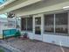 Inviting covered patio with bench seating and entrance to the home at 1531 Oakview Se Cir, Winter Haven, FL 33880
