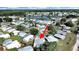 Aerial view of a charming home in a well-maintained neighborhood, near a scenic lake at 1534 Longbow Dr, Lakeland, FL 33810