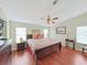 Comfortable bedroom featuring neutral tones, a ceiling fan, and a window to let in plenty of light at 1534 Longbow Dr, Lakeland, FL 33810