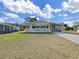 Charming single-story home with white exterior, covered porch, and well-maintained lawn at 1534 Longbow Dr, Lakeland, FL 33810