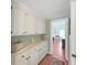 Hallway that features built in cabinets with view of a bedroom at the end of the hallway at 1534 Longbow Dr, Lakeland, FL 33810