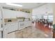 Functional kitchen with white appliances and easy access to dining area at 1534 Longbow Dr, Lakeland, FL 33810