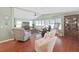 Cozy living room featuring vaulted ceilings, recessed lighting, a ceiling fan and comfortable furniture at 1534 Longbow Dr, Lakeland, FL 33810