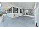 Spacious covered patio area with comfortable seating and ample space for outdoor entertaining at 1534 Longbow Dr, Lakeland, FL 33810