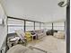 Bright sunroom with large windows and tiled floors perfect for relaxation or hobbies at 1534 Longbow Dr, Lakeland, FL 33810