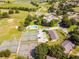 Aerial view shows the pool, tennis courts, and golf course of this beautiful community at 1602 Eagle Pond Dr # 1602, Winter Haven, FL 33884