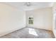 Neutral bedroom with a window that provides natural light and outdoor views at 1602 Eagle Pond Dr # 1602, Winter Haven, FL 33884