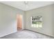 Bright bedroom with a large window and walk-in closet at 1602 Eagle Pond Dr # 1602, Winter Haven, FL 33884
