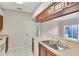 Kitchen featuring stainless steel sink and partial view of living area at 1602 Eagle Pond Dr # 1602, Winter Haven, FL 33884