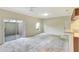 Open living area with sliding glass doors and a partial view of kitchen at 1602 Eagle Pond Dr # 1602, Winter Haven, FL 33884