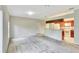 View of the living room with neutral walls and a kitchen bar at 1602 Eagle Pond Dr # 1602, Winter Haven, FL 33884