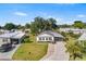 An inviting single-story home with a paved driveway, carport, and lush green lawn at 1610 Reynolds Rd # 72, Lakeland, FL 33801