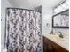 Bathroom featuring a single sink vanity, mirrored medicine cabinet, toilet, and shower at 1610 Reynolds Rd # 72, Lakeland, FL 33801