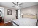 Cozy bedroom with a ceiling fan, wood-look floors, and neutral wall colors at 1610 Reynolds Rd # 72, Lakeland, FL 33801