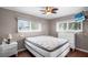 Bedroom featuring two windows, a ceiling fan, a TV, and a white dresser at 1610 Reynolds Rd # 72, Lakeland, FL 33801