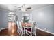 Open dining space flows seamlessly to the kitchen, features hardwood floors, modern ceiling fan at 1610 Reynolds Rd # 72, Lakeland, FL 33801