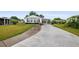 Charming single-story home featuring a covered carport and a well-maintained front yard and walkway at 1610 Reynolds Rd # 72, Lakeland, FL 33801