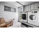 Laundry room featuring a window, door, a washing machine, and a dryer at 1610 Reynolds Rd # 72, Lakeland, FL 33801