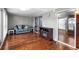 Comfortable living area features wood floors, a cozy sofa, and a decorative fireplace at 1610 Reynolds Rd # 72, Lakeland, FL 33801