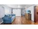 Open-concept living room with hardwood floors, barn doors, and easy access to the dining area at 1610 Reynolds Rd # 72, Lakeland, FL 33801