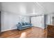 Inviting living room featuring wood floors, a plush sofa, and stylish barn doors at 1610 Reynolds Rd # 72, Lakeland, FL 33801