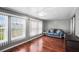 Cozy living room with rich wood floors, bright windows, and comfortable seating at 1610 Reynolds Rd # 72, Lakeland, FL 33801