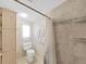 Clean bathroom with a shower, toilet, and ample storage at 1746 Fox Hill Dr, Lakeland, FL 33810