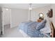 Comfortable bedroom featuring a ceiling fan, carpet, and a charming dresser with decorations at 1746 Fox Hill Dr, Lakeland, FL 33810