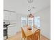 Cozy dining area featuring wood table set, bright windows, and overhead lighting at 1746 Fox Hill Dr, Lakeland, FL 33810