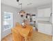Inviting dining area features wood table, and colorful lighting fixture for a cozy meal at 1746 Fox Hill Dr, Lakeland, FL 33810