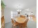 Bright dining area with wood table, natural light, and views into the kitchen, perfect for Gathering meals at 1746 Fox Hill Dr, Lakeland, FL 33810